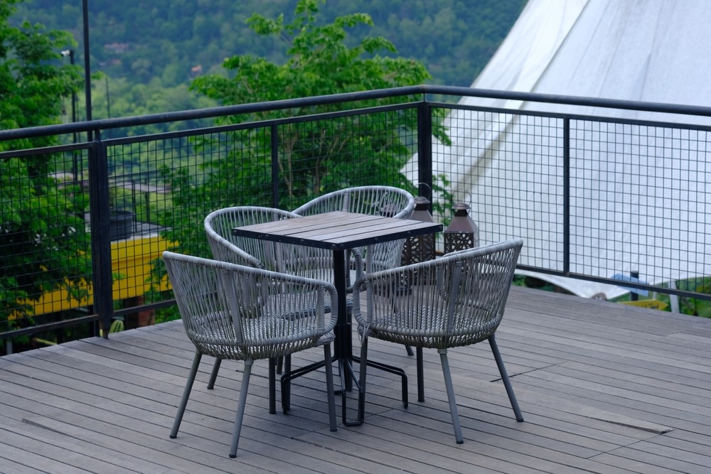 Outdoor wicker dining set on terrace by Urbanland Products, leading Wicker Dining Sets manufacturer in India